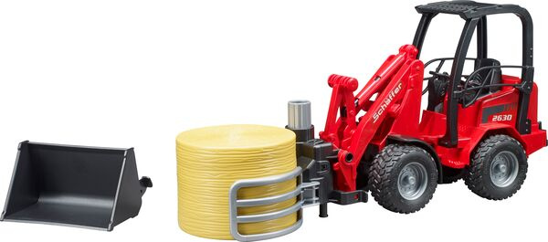 Schäffer Hoflader mit Ballengreifzange und Rundballen