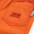 Orangefarbene Hose Babykollektion Safari Adventure Frühjahr/Sommer 2022